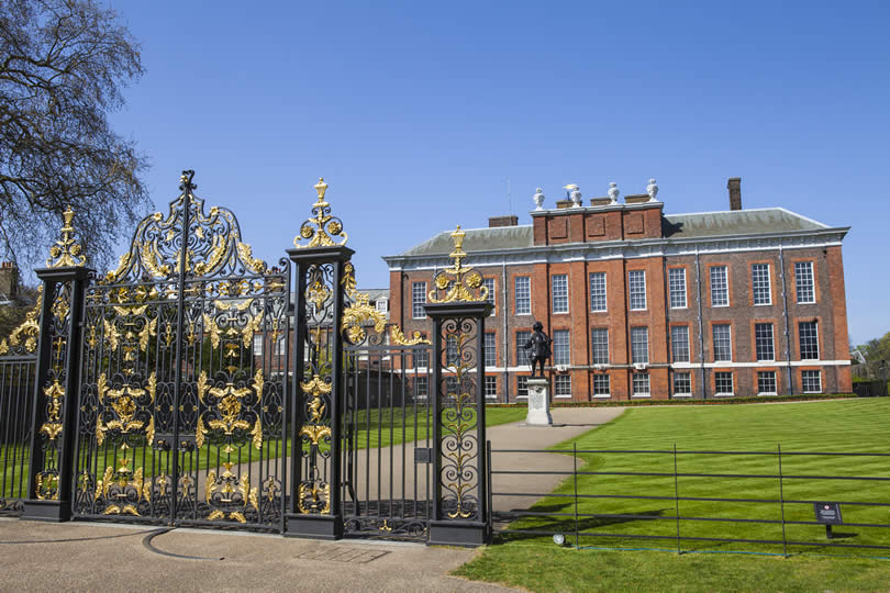Kensington Palace in London with statue of King William III