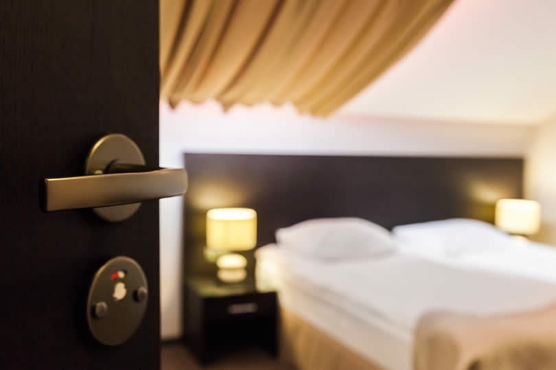 Hotel door and bedroom